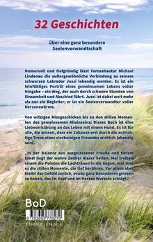 "32 Geschichten über eine ganz besondere Seelenverwandtschaft." Küstenlandschaft mit Meer und Gräsern im Hintergrund.