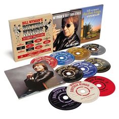 "Bill Wyman's Rhythm Kings Ultimate Collection" umfasst mehrere CD-Hüllen und bunte CDs mit Bildern und Texten auf den Covern.