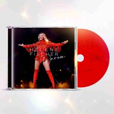 Texte: "HELENE FISCHER Warum." Eine Frau in rotem Glitzer-Outfit mit ausgebreiteten Armen.
