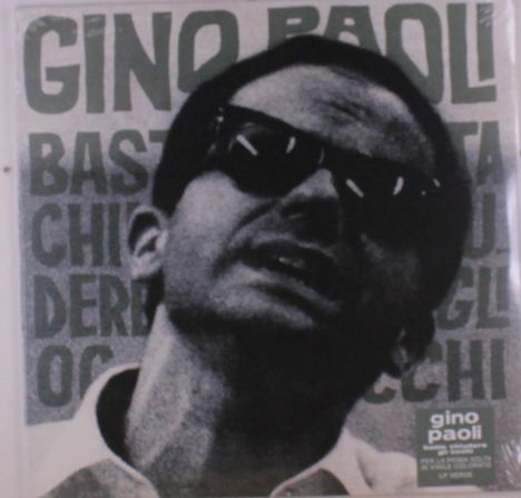 "Gino Paoli" in großen Buchstaben, darunter teils verdeckte, kleinere Texte. Schwarz-weiß Portrait eines Mannes mit Sonnenbrille.