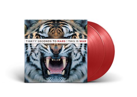 "THIRTY SECONDS TO MARS | THIS IS WAR" steht über dem Bild eines brüllenden Tigers mit rot gefärbten Schallplatten.