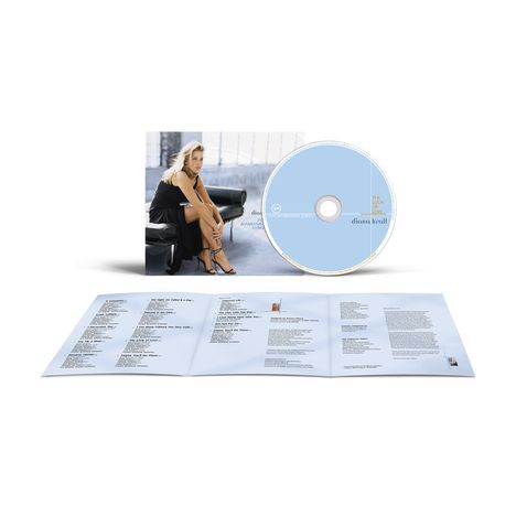 Ein CD-Cover zeigt "The Look of Love" und "Diana Krall" auf einem blauen Hintergrund. Eine blonde Frau sitzt auf einem Sofa.