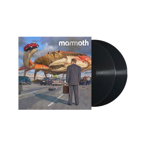 Text: "mamoth." Illustration: Ein riesiger Krebs hebt ein Auto hoch, ein Mann im Anzug steht mit einem Koffer davor.