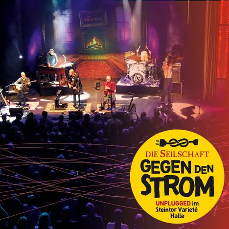 Logo: "Die Seilschaft: Gegen den Strom. Unplugged im Steintor Varieté Halle." Bühne mit Musikern und Publikum.