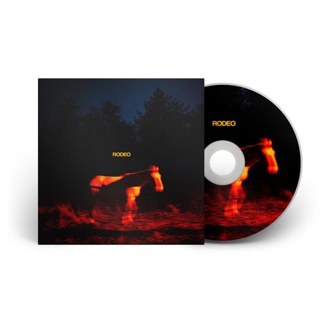 Text "RODEO" in Gelb. Ein brennendes Pferdebild vor dunklen Bäumen. CD-Hülle und Disc zeigen dieselbe Szene.
