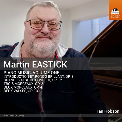 Text: "Martin EASTICK, PIANO MUSIC, VOLUME ONE, FIRST RECORDINGS, Ian Hobson". Ein lächelnder Mann vor einem Klavier.