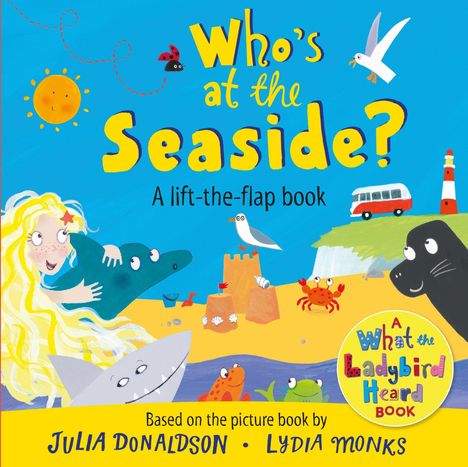 "Who’s at the Seaside?" steht groß, mit Illustrationen von Meer und Tieren wie Delfin, Möwe, Krabbe und einem Mädchen.