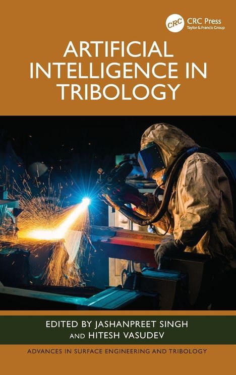 "Artificial Intelligence in Tribology" ist das Thema. Ein Arbeiter schweißt und funkensprüht in einer Werkstatt.