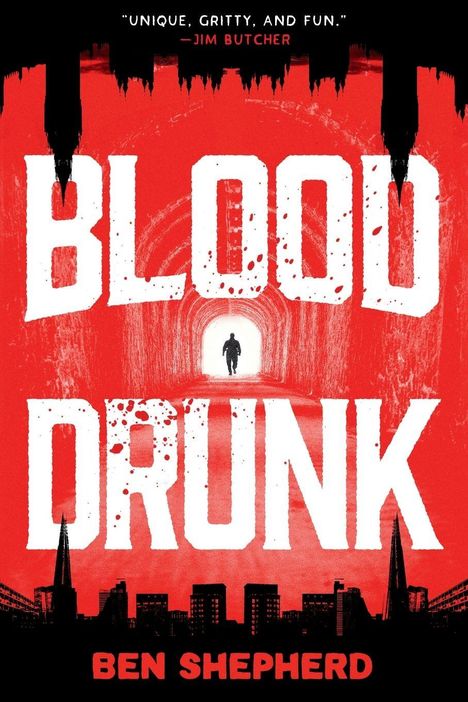 "Blood Drunk", Ben Shepherd, Zitat: "Unique, gritty, and fun." Silhouette einer Figur in einem Tunnel, Skyline im Hintergrund.
