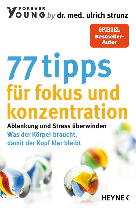 "77 tipps für fokus und konzentration" steht in großen, bunten Buchstaben, darunter bunte Murmeln.