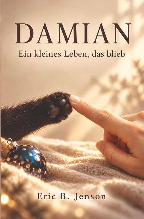 "Damian: Ein kleines Leben, das blieb. Eric B. Jenson." Eine Hand berührt eine schwarze Katzenpfote neben einer blauen Kugel.