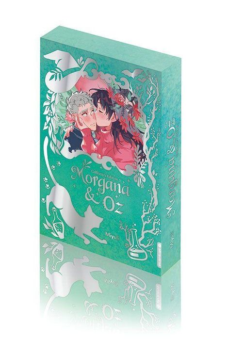 "Morgana & Oz" in geschwungenen Buchstaben, Illustration: Zwei Personen in rosa und Blumenrahmen, Katze, grün-türkisfarben.