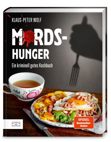 „Mordshunger: Ein kriminell gutes Kochbuch“ von Klaus-Peter Wolf. Ein Teller mit Spiegelei, Garnelen und Tee.