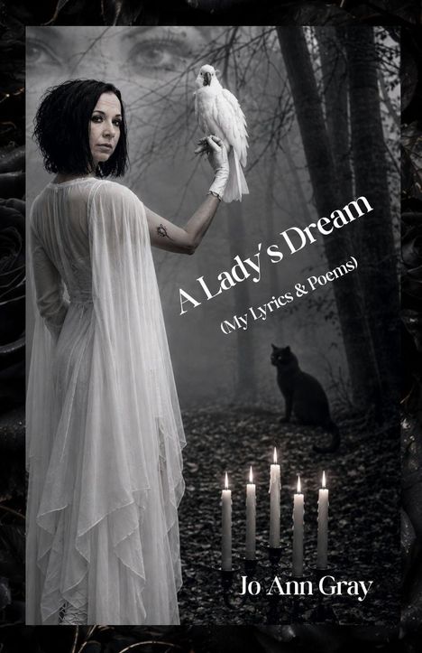 Text: "A Lady's Dream (My Lyrics & Poems)", "Jo Ann Gray". 

Eine Frau in weiß mit Vogel, schwarze Katze, Kerzen.