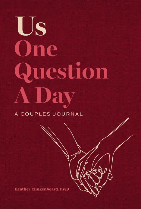 "Us One Question A Day: A Couples Journal" in großer Schrift, darunter eine Zeichnung zweier verbundener Hände.