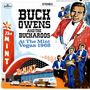Text im Bild: "BUCK OWENS AND THE BUCKAROOS At The Mint Vegas 1968". Illustration mit Musikern, großen Schriftzügen und einem Gebäude.