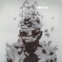 Text: "LINKIN PARK LIVING THINGS". Illustration eines Gesichts, das in weiße, fragmentierte Partikel zerfällt.