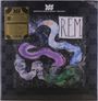 „R.E.M.”, goldener Text links; abstrakte, bunte Schlangenform.