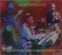 Text: "MOVE WITH LOVE" oben, "LAFAYETTE GILCHRIST & NEW VOLCANOES" unten. Musikalische Illustration mit Musikern.
