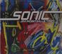 Text: "SONIC JIM ROBITAILLE TRIO". Bunte, abstrakte Zeichnungen mit lebhaften Formen und Linien in Gelb, Blau, Rot.