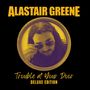 ALASTAIR GREENE, Trouble at Your Door, DELUXE EDITION. Ein Mann mit Sonnenbrille in einem kreisförmigen Rahmen.