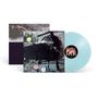 Vinyl-Schallplatte in Hellblau, Cover zeigt eine dunkle, surreale Szene mit rosa und gelben Akzenten. Text: "Psychic..."