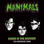 "MANIMALS" in grün, "BLOOD IS THE HARVEST" und "40TH ANNIVERSARY EDITION" unten. Drei Gesichter mit dramatischem Make-up.