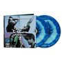 Cover mit "Liquid Tension Experiment 2" und vier Musikerporträts. Zwei blaue Vinyl-Schallplatten daneben.