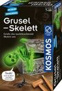 „Mitbring Experimente“, „Grusel-Skelett“, „Grabe das nachtleuchtende Skelett aus“, „KOSMOS“. Ein Skelett in Erde.