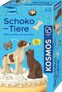 „Mitbring Experimente Schoko-Tiere. Selbst gießen und gestalten.“ Zwei Hunde aus Schokolade auf einem Kuchen.
