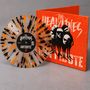 „The Headlines“ und „Antidote“ auf Plattencover. Splatter-Vinyl in Orange, Schwarz. Cover zeigt Köpfe auf rotem Hintergrund.