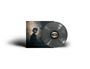 Unten steht: "unless I ask you, unless I tell". Eine Vinylplatte mit einem Auge-Design und ein Gemälde eines Profils.