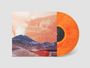 "inferno on fillmore" auf einem Albumcover. Illustration zeigt eine vulkanische Landschaft mit einer orangefarbenen Vinylschallplatte.