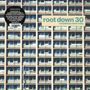 Text: "root down 30 compiled by rainer trüby". 
Hintergrund: Gebäude mit vielen Fenstern.