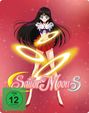 Text: FSK ab 12 freigegeben, Sailor Moon S. Eine Anime-Figur in Schulmädchenoutfit mit glühenden Ringen, pinker Hintergrund.