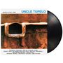 "UNCLE TUPELO, MARCH 16-20, 1992" steht oben. Darunter rostfarbenes, quadratisches Kunstwerk und eine schwarze Schallplatte.