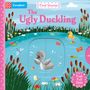 Text: "The Ugly Duckling", "First Stories", "Push Pull Slide".  
Illustration: Ein Entlein im Teich mit Schilf und Blumen.