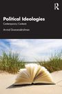 "Political Ideologies", "Contemporary Contexts", Arvind Sivaramakrishnan. Ein geöffnetes Buch liegt im Gras vor einem Strand.