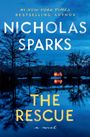 Text: "#1 New York Times Bestselling Author Nicholas Sparks, The Rescue, a novel." Ein beleuchtetes Haus am Wasser umgeben von Bäumen.
