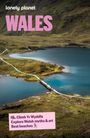 Text: "lonely planet", "WALES", "Climb Yr Wyddfa", "Explore Welsh myths & art", "Best beaches". Natur mit Seen und einem Pfad.