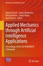 „Applied Mechanics through Artificial Intelligence Applications“ steht in Weiß auf rotem Hintergrund mit Logos unten.
