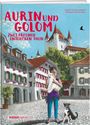 "Aurin und Golom: Zwei Freunde entdecken Thun". Gemälde einer Stadt mit Schloss, Kind mit Katze, Hund daneben.