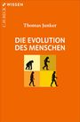 „Die Evolution des Menschen“ von Thomas Junker. Silhouetten wandelnder Vorfahren auf orangefarbenem Hintergrund.