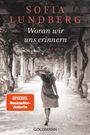 "Sofia Lundberg - Woran wir uns erinnern. Roman. SPIEGEL Bestseller-Autorin. Eine Frau in einem langen Laubengang."