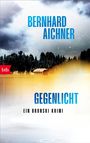 „BERNHARD AICHNER“, „GEGENLICHT“, „EIN BRONSKI KRIMI“, „btb“ Logo; verschneiter Wald, Hütte, neblige Atmosphäre.