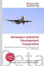 Text: Aerospace Industrial Development Corporation. Darunter fliegt ein Flugzeug im klaren blauen Himmel.