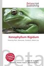 Text: “Xenophyllum Rigidum. Flowering Plant, Asteraceae, Grassland, Habitat Loss.” Logo von Betascript Publishing. Nahaufnahme eines Frosches.