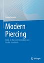 "Modern Piercing: State-of-the-Art-Techniken und Studio-Standards" von Stefan Draxler. Blaues Cover, Logo unten rechts.