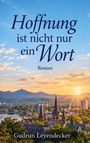 „Hoffnung ist nicht nur ein Wort“ steht in großen Buchstaben. Im Hintergrund Berge, eine Stadt und ein Sonnenuntergang.