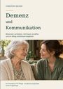 Text: "Demenz und Kommunikation." Zwei lächelnde Frauen, eine ältere und eine jüngere, sitzen nah beieinander.